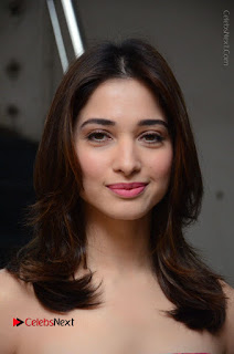 Actress Tamanna Latest Images in Floral Short Dress at Okkadochadu Movie Promotions  0019.JPG