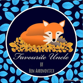 A stylised drawing of a fox from Pixabay, curled on a pile of leaves. Text below reads 'Merry Christmas'. The border is blue.