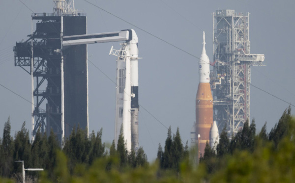 At left, SpaceX's Falcon 9 rocket continues to get prepped for its April 8 Ax-1 launch to the International Space Station from Kennedy Space Center's Launch Complex 39A, while at right, NASA's Space Launch System is ready to resume the Artemis 1 wet dress rehearsal at KSC's Launch Complex 39B...on April 6, 2022.