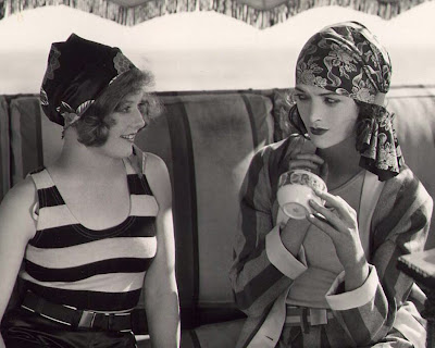 Seaside flappers Agnes Franey and Myrna Loy show off the latest 1929 beach 