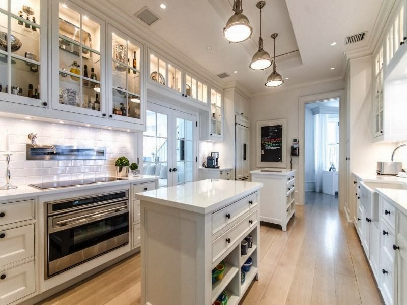 White kitchen in Custom built celebrity home for Celine Dion