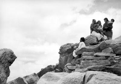 Native Americans on rock outcropping on the Acoma Pueblo in New Mexico, 1935. Photographed by Margaret Bourke-White for TWA