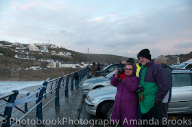 Crowds gather to watch the giant waves at Portreath in Cornwall