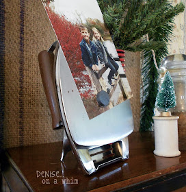 Vintage Iron as a Photo Holder in a Christmas Vignette via http://deniseonawhim.blogspot.com