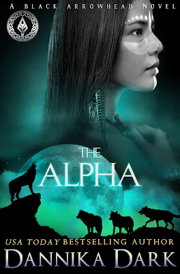 A profile of a Native American woman looking stoic, feather earrings hanging and a teal-green background. Silhouette beneath her of wolves