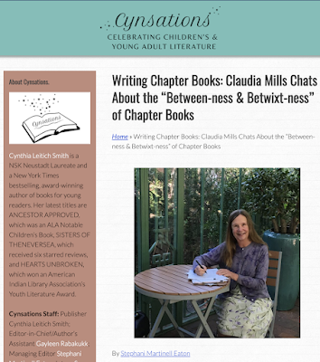 screen shot of the article "Writing Chapter Books: Claudia Mills Chats About the “Between-ness & Betwixt-ness” of Chapter Books" showing the headline and a photo of Claudia sitting at an outdoor table, writing