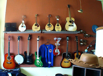 pegboard holding guitars