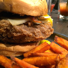 Chuck P's Burger: White Bun, Fat City (Burger stuffed with Cheese and deep-fried), Swiss Cheese, Pecan Smoked Bacon, Peanut Butter and a Fried Egg.