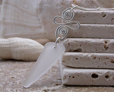 Sea glass pendant with a piece of white sea glass collected from a beach in Rincon, Puerto Rico