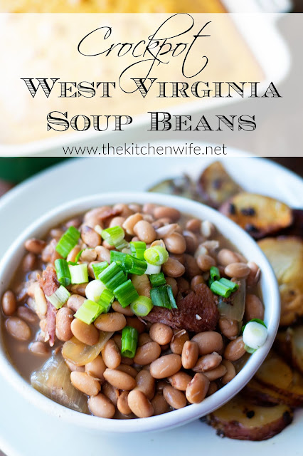 A bowl of the finished soup beans with a side of fried potatoes and cornbread. 