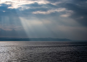 Photo of sunshine breaking through the clouds over the Solway Firth on Sunday