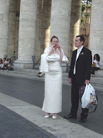 A bride and groom waiting to see the pope