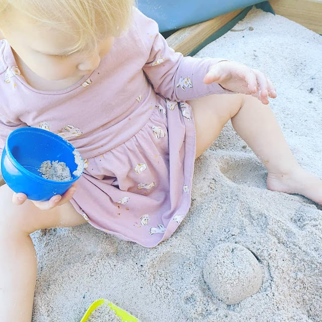 child in sandpit