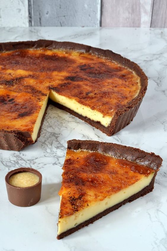 Creme Brulee Tart - Chocolate pastry, filled with sweet custard and topped with a caramel layer.