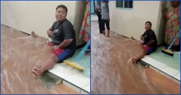 Kocak Cara Orang Halau Aliran Banjir di Depan Rumah, Netizen: Tanggul Hidup