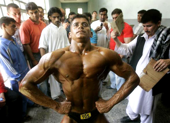 biceps flexing, guy in Hanes, muscle hunk