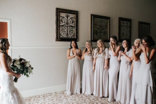 bridesmaids seeing the bride for the first time