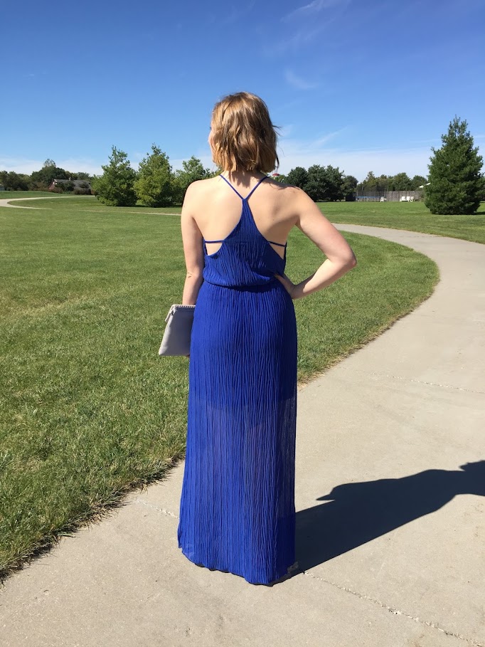 A cobalt blue maxi dress with cutouts for a subtly sexy evening look. 