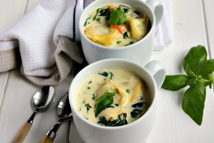 Mugs of tortellini soup