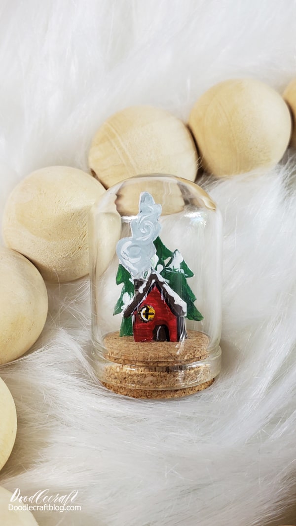 How to Make a Miniature Cabin in Woods Cloche!  This tiny little miniature cabin in the woods is the perfect craft for a July afternoon. Make the tiniest and most adorable Winter scene captured in a bottle.   I love working on Christmas projects in July because it's warm outside, I feel like being busy...and I'm not swamped with holiday have-to's.