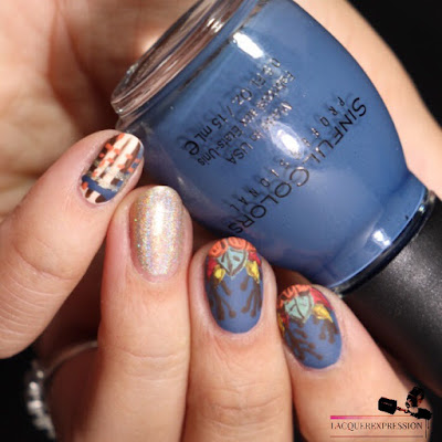 hand painted nail art design of fall leaves and pumpkin over a blue background for Thanksgiving