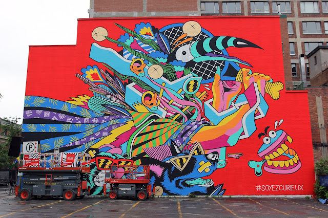 Our live coverage of Mural Festival 2015 is soon coming to an end but we still have a bunch of goodies to share with you. The Brazilian lads from Bicicleta Sem Freio just wrapped up the Mural's biggest building with this super vibrant artwork which is featuring some of their signature psychedelic imagery.