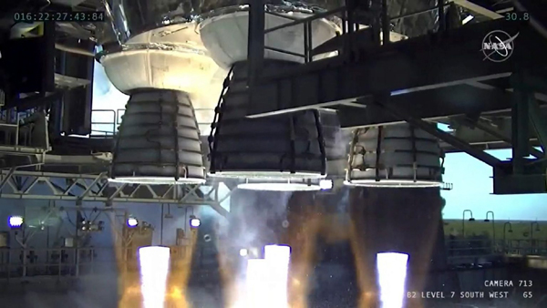 Atop the B-2 Test Stand at NASA's Stennis Space Center near Bay St. Louis, Mississippi, the Space Launch System's four RS-25 engines fire for 67 seconds (out of a planned 485 seconds) before shutting down during the first Green Run hot fire test...on January 16, 2021.