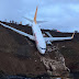 Passenger jet skids off runway and stops METRES from sea