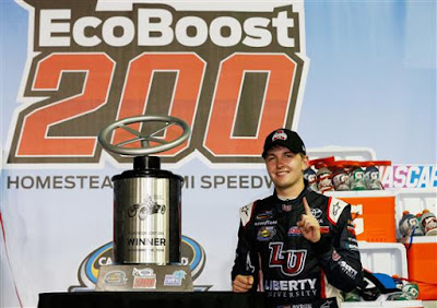 William Byron, driver of the #9 Liberty University Toyota, poses with the trophy in Victory Lane after winning the NASCAR Camping World Truck Series Ford EcoBoost 200. #nascar