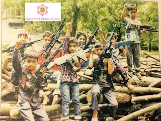 Kashmiri kids posing with gun props to alert the people of India of war.