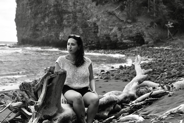 black and white portrait on drift wood at Pololu black sand beach