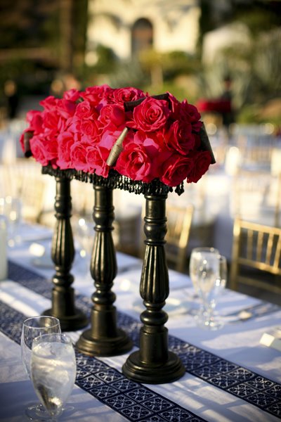 Lovely table center pieces made up of pink roses just like the brides 