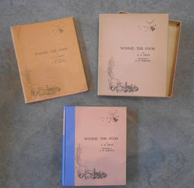 Picture showing the box, cover, and glassine covered book jacket for the deluxe edition