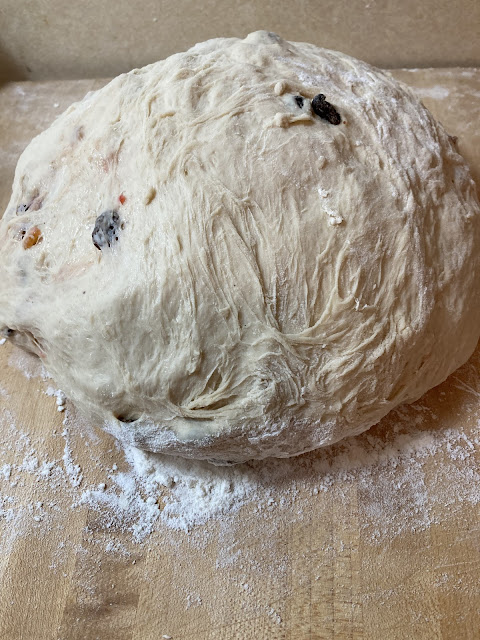 Ball of christmas bread dough after adding all the fruit and spice