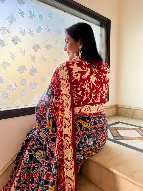 Double ikat patan patola with hand embroidered parsi gara on border, pallu and blouse.