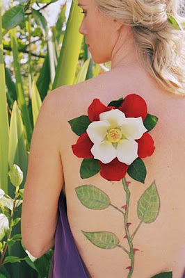 Girl Tattoo and Piercing in Sexy Back Flower Design