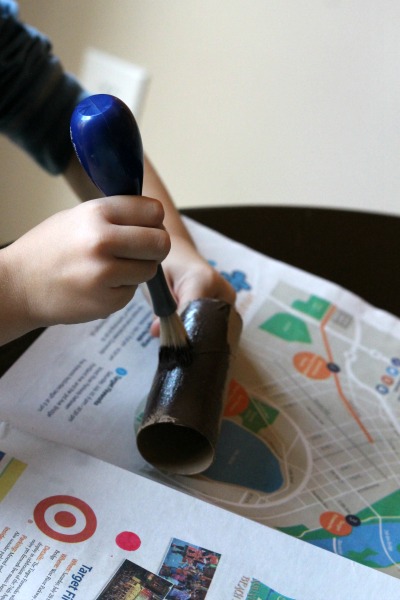 Thanksgiving turkey craft kids can make from a cardboard tube and coffee filter