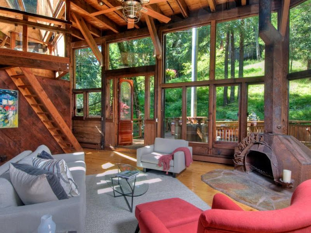 Photo of living room during the day inside of tree house in the forest