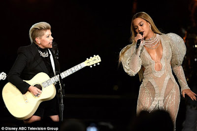 Beyonce steals the show in a low-cut sheer dress at the 50th Annual Country Music Association Awards