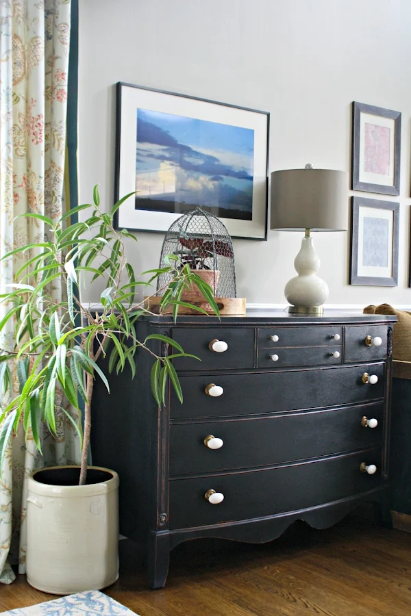 white knobs black dresser