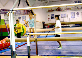 Tessa on balance beam during summer camp.