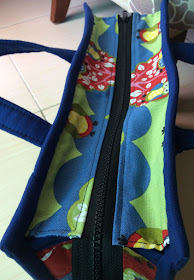 The bag with its top zipper closure