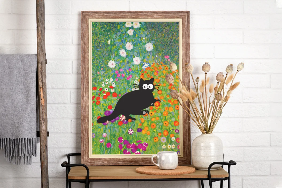 a painting of a black cat hanging on a white wall