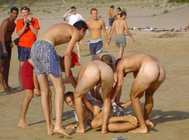 Beach pantsing from two hot naked guys