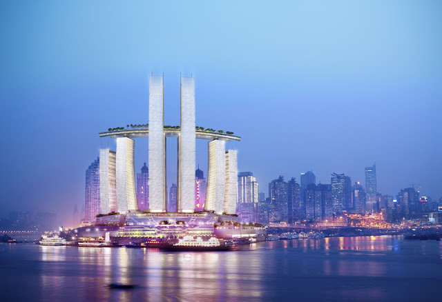 Photo of new complex as seen at night from across the river