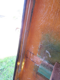 edge of a fiberglass trailer door frame