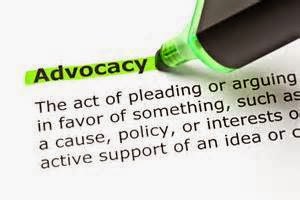 Closeup picture of a definition for the word Advocacy, with a green highlighter pen marking the word