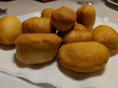 Dining at Maso Runch. Canci arstis - leavened and fried ravioli with spinach or poppy seeds