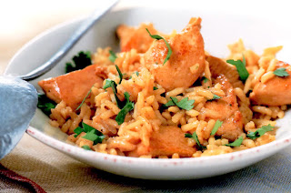One-pot dish of curried chicken and rice served garnished with coriander (cilantro) leaves