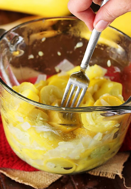 Mashing Boiled Summer Squash with a Fork Image